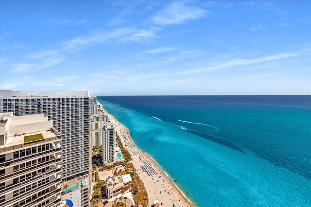 bird's eye view featuring a beach view and a water view