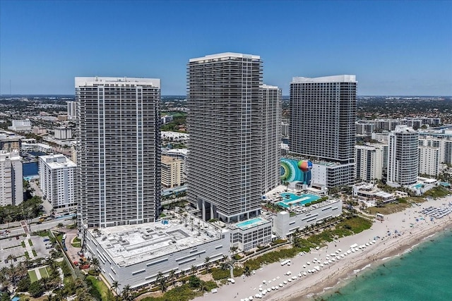 property's view of city featuring a view of the beach and a water view