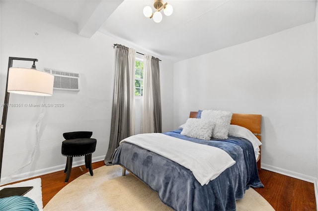 55 NE 87th St, El Portal, FL 33138 - bedroom with baseboards, wood finished floors, an AC wall unit, and beam ceiling