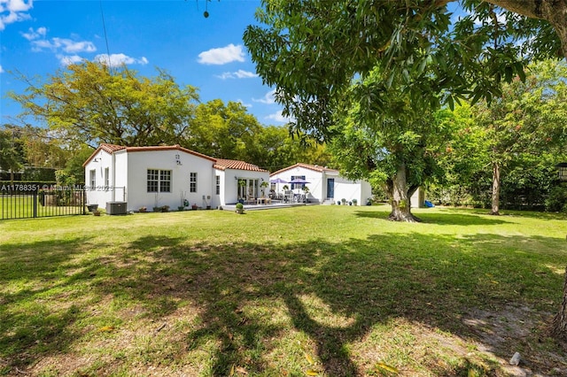 55 NE 87th St, El Portal, FL 33138 - back of property with fence, stucco siding, a lawn, and cooling unit
