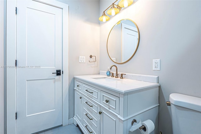 half bathroom featuring toilet and vanity
