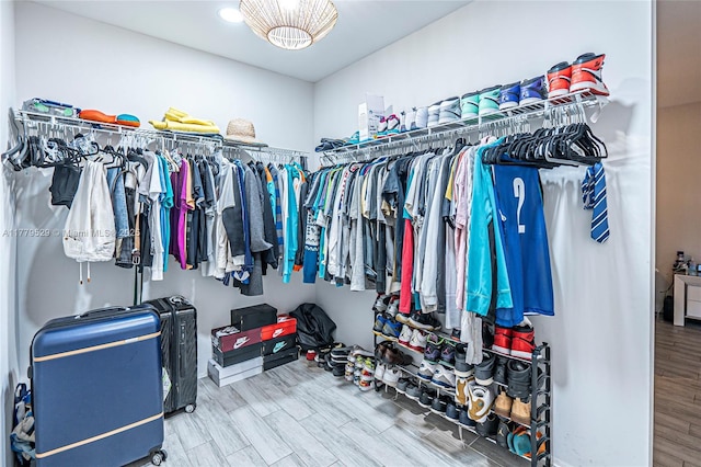 walk in closet featuring wood finished floors