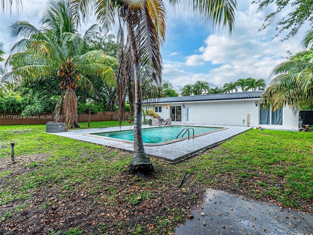 view of swimming pool with a fenced in pool, a yard, and a fenced backyard