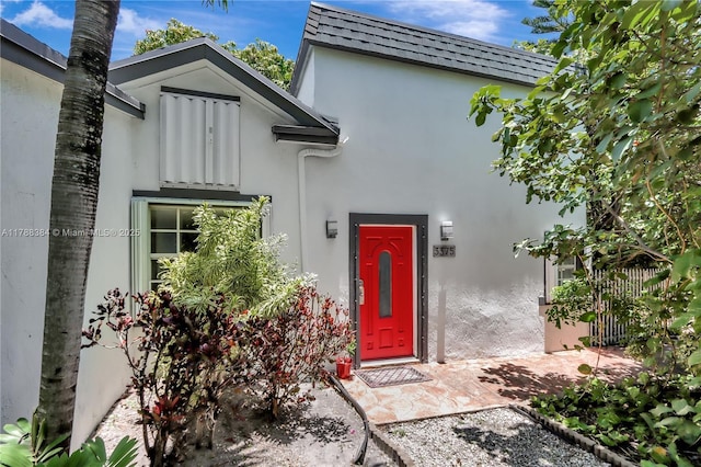 3375 SW 29th Ter, Miami, FL 33133 - doorway to property with stucco siding