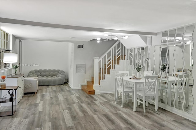 3375 SW 29th Ter, Miami, FL 33133 - dining room with stairway, wood finished floors, and a chandelier