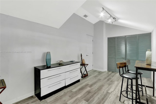 3375 SW 29th Ter, Miami, FL 33133 - dining area featuring lofted ceiling, track lighting, and light wood-style floors