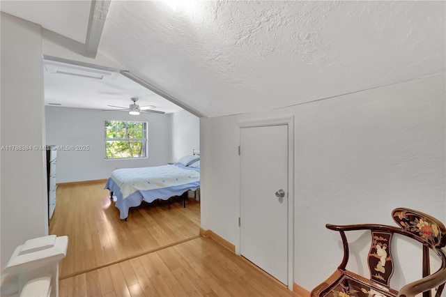 3375 SW 29th Ter, Miami, FL 33133 - bedroom featuring light wood finished floors, ceiling fan, and a textured ceiling