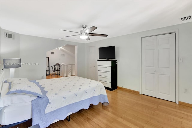 3375 SW 29th Ter, Miami, FL 33133 - bedroom featuring light wood finished floors, a ceiling fan, and arched walkways