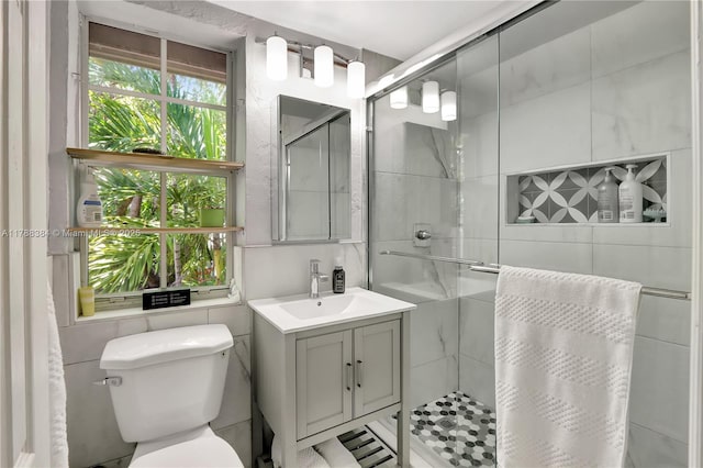 3375 SW 29th Ter, Miami, FL 33133 - full bathroom with a stall shower, vanity, and tile walls
