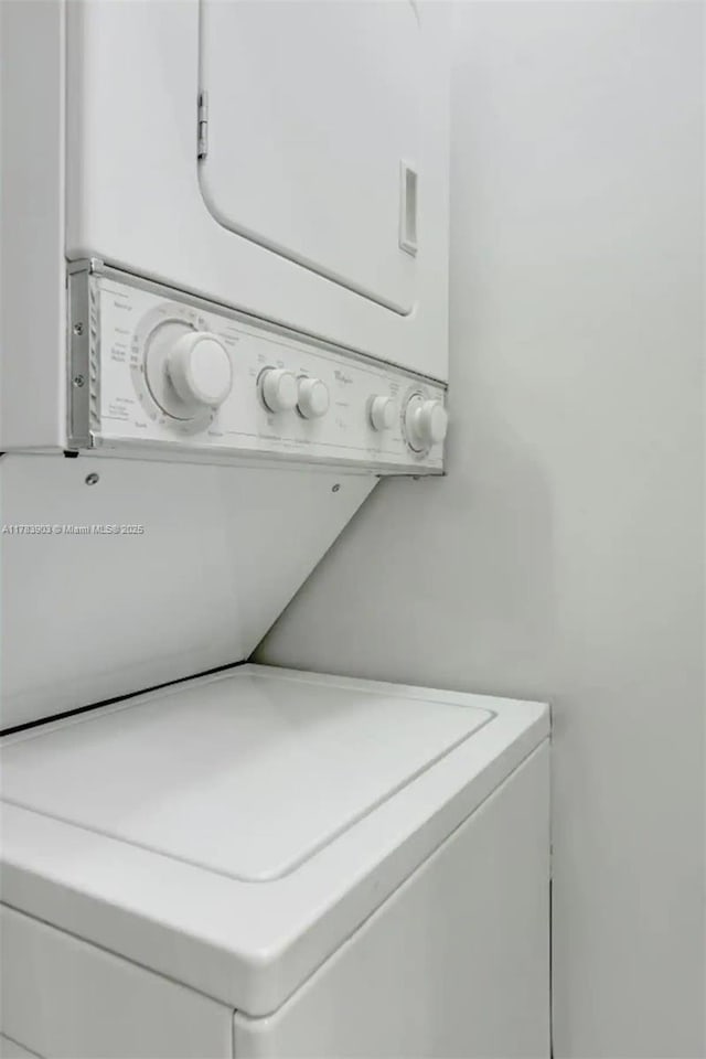 1200 Brickell Bay Dr Unit 1404, Miami, FL 33131 - clothes washing area featuring stacked washer / drying machine and laundry area