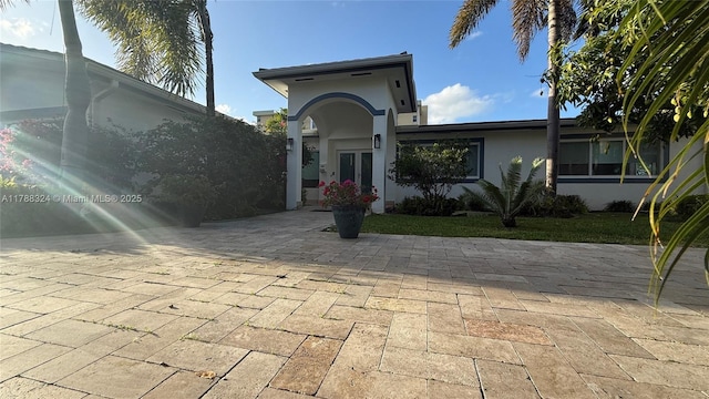 view of front of house featuring french doors and stucco siding