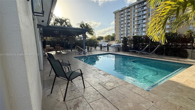 community pool with a patio area
