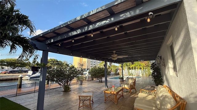 view of patio with an outdoor pool, a fenced backyard, and ceiling fan