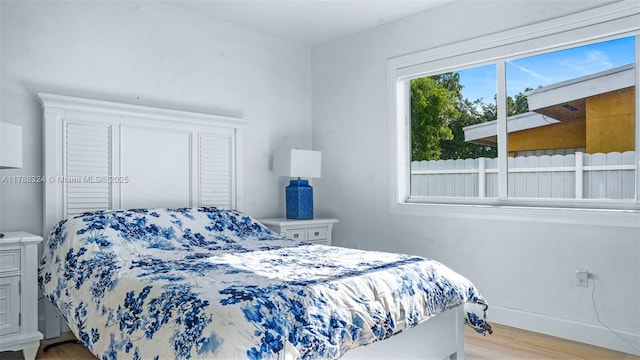 2105 Arch Creek Dr, North Miami, FL 33181 - bedroom with light wood finished floors and baseboards