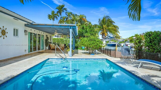 2105 Arch Creek Dr, North Miami, FL 33181 - view of pool with a patio, ceiling fan, and fence
