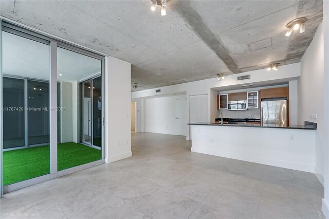 3451 NE 1st Ave Unit M0808, Miami, FL 33137 - kitchen with visible vents, dark countertops, a peninsula, and appliances with stainless steel finishes