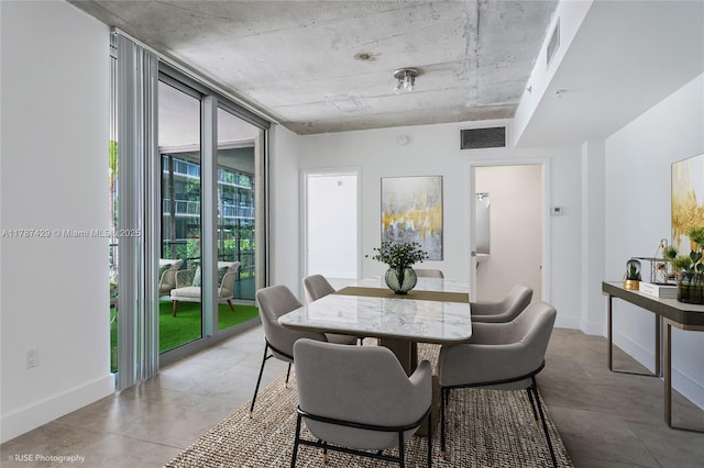 3451 NE 1st Ave Unit M0808, Miami, FL 33137 - dining room featuring visible vents and baseboards