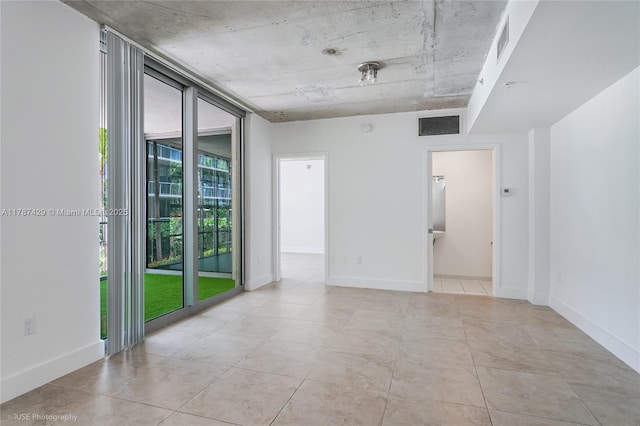 3451 NE 1st Ave Unit M0808, Miami, FL 33137 - tiled spare room featuring visible vents and baseboards