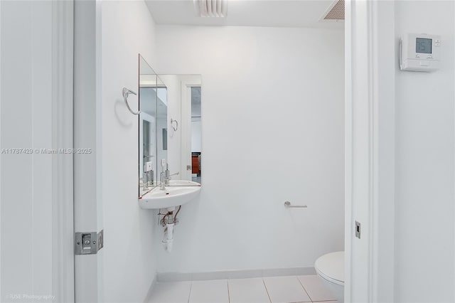 3451 NE 1st Ave Unit M0808, Miami, FL 33137 - half bathroom featuring visible vents, toilet, tile patterned flooring, and baseboards