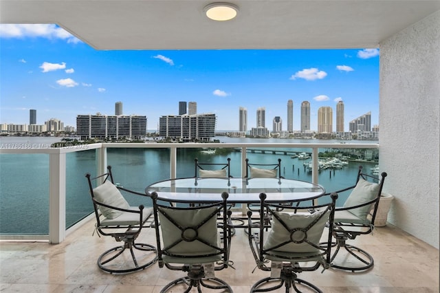 3201 NE 183rd St Unit 1107, Aventura, FL 33160 - balcony featuring a view of city, outdoor dining space, and a water view