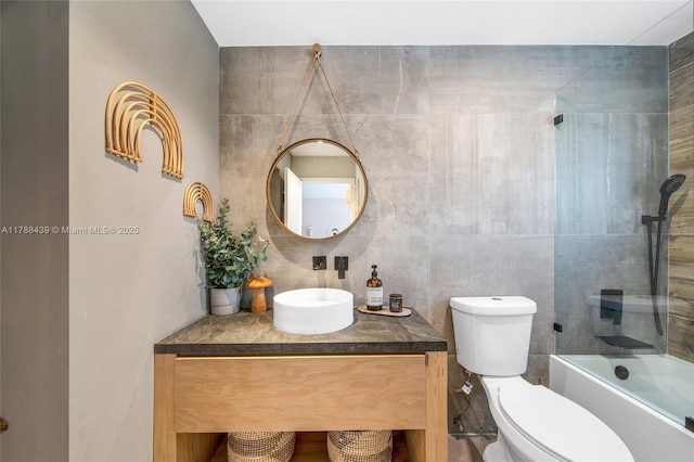 381 Franklin St, Hollywood, FL 33019 - bathroom with tile walls, shower / bathtub combination, vanity, and toilet