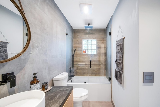 381 Franklin St, Hollywood, FL 33019 - full bathroom featuring tile walls, a combined bath / shower with rainfall shower, toilet, and vanity
