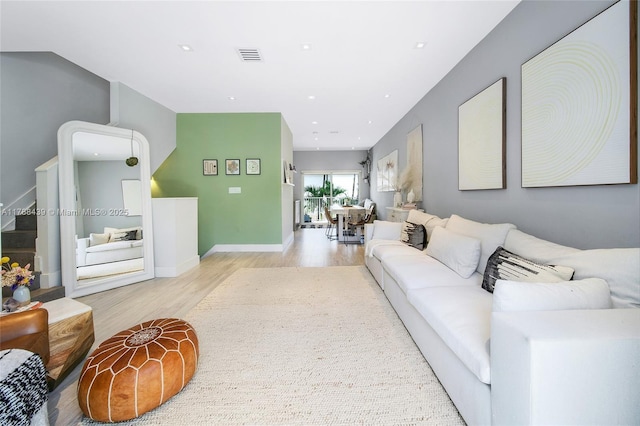 381 Franklin St, Hollywood, FL 33019 - living area with baseboards, wood finished floors, visible vents, and stairs