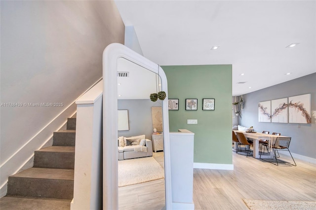 381 Franklin St, Hollywood, FL 33019 - stairway featuring visible vents, baseboards, and wood finished floors