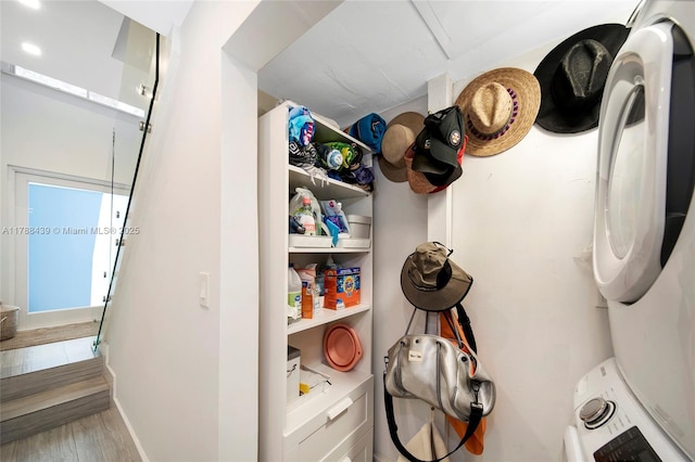 381 Franklin St, Hollywood, FL 33019 - washroom with stacked washer / drying machine, baseboards, wood finished floors, and laundry area