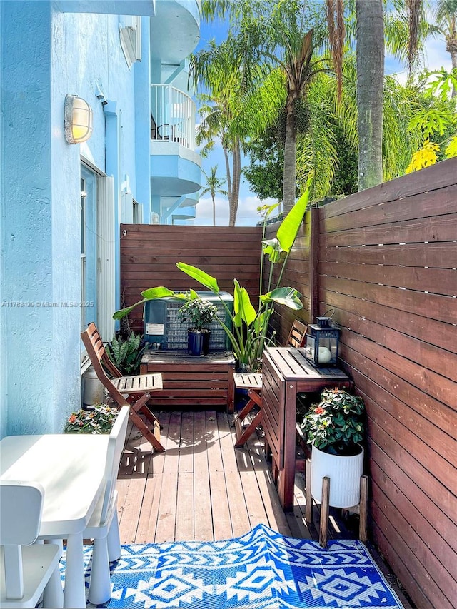 381 Franklin St, Hollywood, FL 33019 - wooden terrace with a fenced backyard