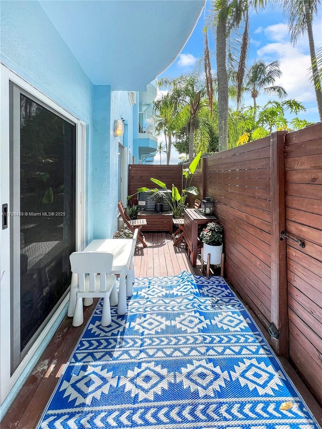 381 Franklin St, Hollywood, FL 33019 - view of wooden balcony with a wooden deck