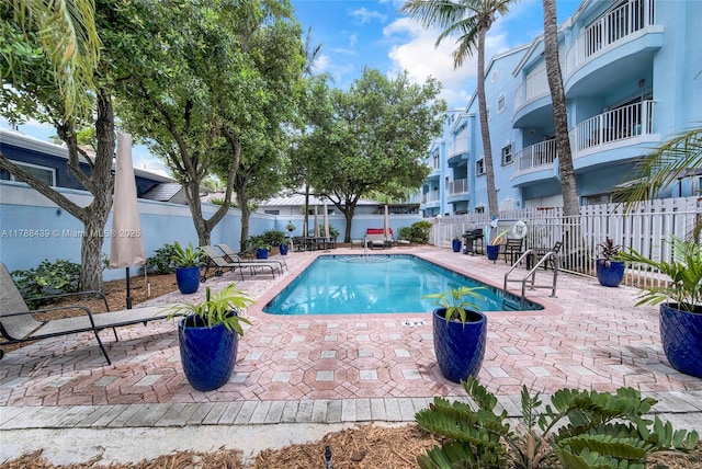 381 Franklin St, Hollywood, FL 33019 - community pool with a patio and fence
