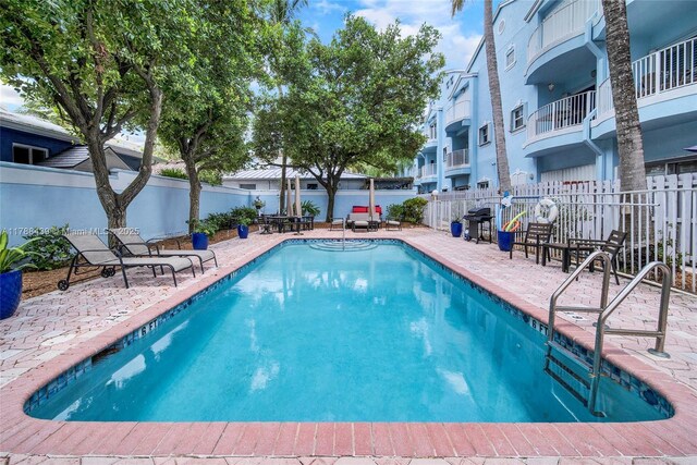 381 Franklin St, Hollywood, FL 33019 - community pool featuring fence and a patio