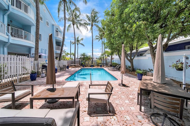 381 Franklin St, Hollywood, FL 33019 - community pool featuring a patio area and a fenced backyard
