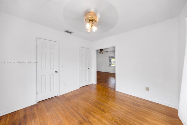 790 NE 96th St, Miami Shores, FL 33138 - unfurnished bedroom featuring a ceiling fan, baseboards, visible vents, and light wood finished floors