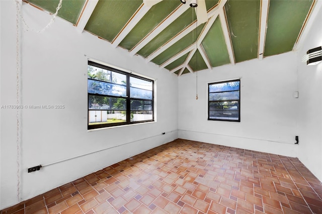 790 NE 96th St, Miami Shores, FL 33138 - spare room with beam ceiling and high vaulted ceiling