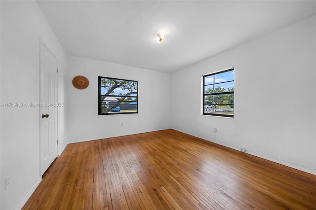 790 NE 96th St, Miami Shores, FL 33138 - empty room with wood-type flooring and baseboards