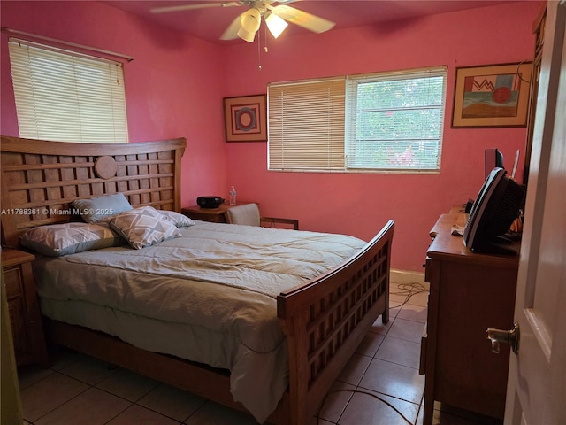1440 NE 117th St, Miami, FL 33161 - bedroom with light tile patterned flooring and ceiling fan
