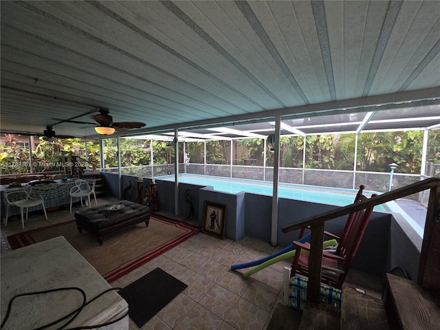 1440 NE 117th St, Miami, FL 33161 - view of patio with an outdoor pool, glass enclosure, and a ceiling fan