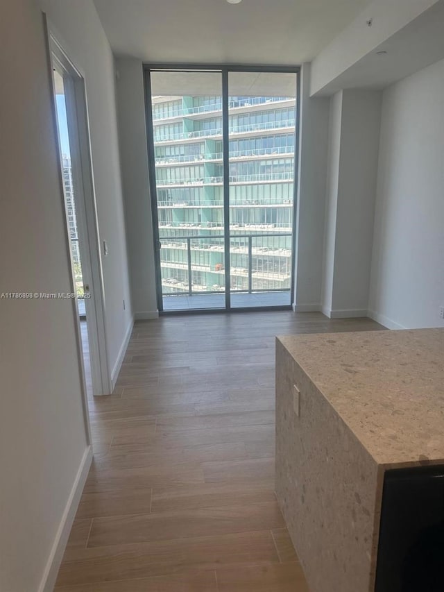 2655 S Bayshore Dr Unit 1607, Miami, FL 33133 - interior space featuring expansive windows, wood finished floors, and a wealth of natural light