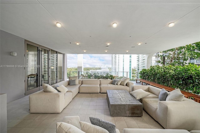 2655 S Bayshore Dr Unit 1607, Miami, FL 33133 - living area with light tile patterned floors and a wall of windows