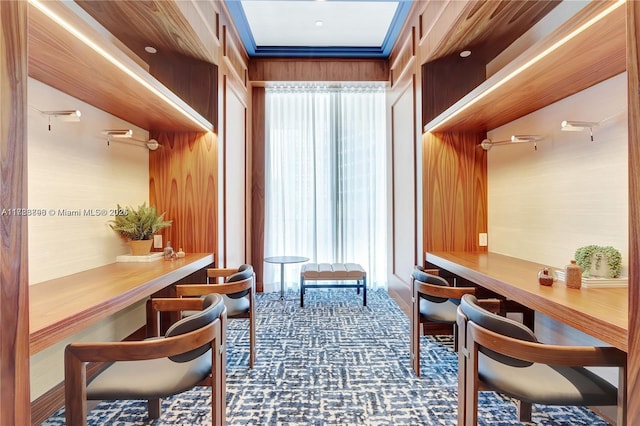 2655 S Bayshore Dr Unit 1607, Miami, FL 33133 - carpeted home office featuring wood walls and a wealth of natural light
