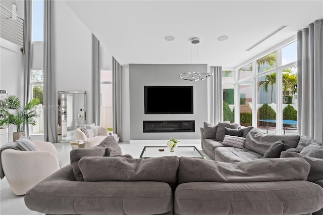 living area featuring a notable chandelier