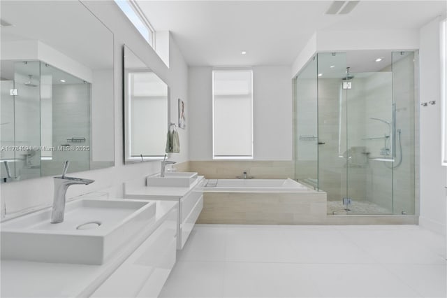 full bath featuring a shower stall, tile patterned floors, a sink, a bath, and visible vents