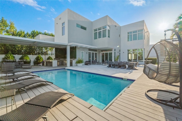 view of swimming pool with fence, a patio area, an outdoor hangout area, and a fenced in pool