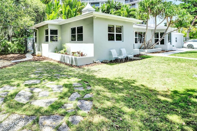 5700 NE 5th Ave, Miami, FL 33137 - view of property exterior featuring a yard and stucco siding