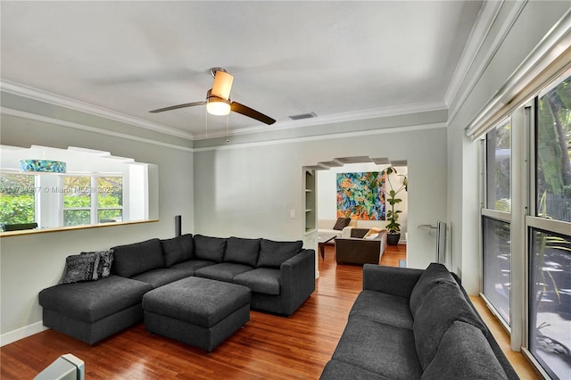 5700 NE 5th Ave, Miami, FL 33137 - living room with healthy amount of natural light, wood finished floors, ceiling fan, crown molding, and baseboards