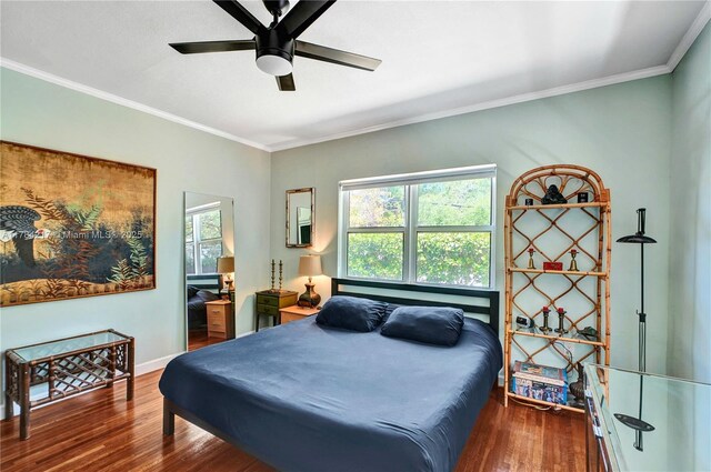 5700 NE 5th Ave, Miami, FL 33137 - bedroom featuring wood finished floors, multiple windows, ornamental molding, and a ceiling fan