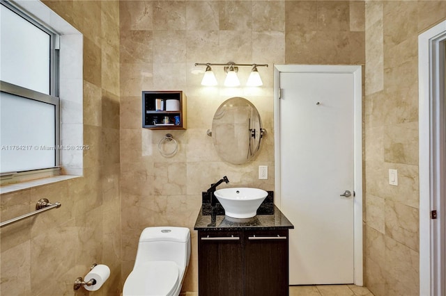 5700 NE 5th Ave, Miami, FL 33137 - bathroom featuring tile walls, vanity, toilet, and tile patterned floors