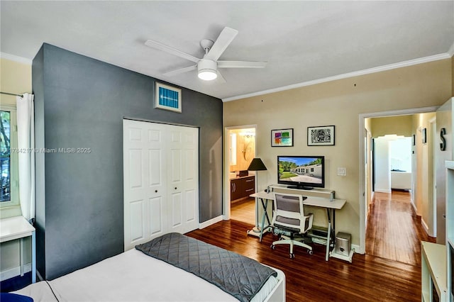 5700 NE 5th Ave, Miami, FL 33137 - bedroom featuring wood finished floors, ornamental molding, a closet, baseboards, and a desk